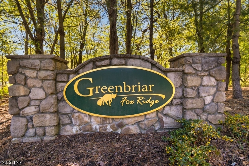 Beautifully appointed and impeccably maintained, this stunning Alaire model shows like new! The gourmet kitchen features abundant wood cabinetry, granite countertops, stainless steel appliances, and ample workspace... Rich hardwood flooring flows throughout the main living areas, adding warmth and elegance. The expansive primary suite offers a private sitting/office area, dual walk-in closets, tiled bath complete with stall shower and dedicated makeup vanity. Spacious second bedroom offers an additional walk-in closet and a beautifully finished tiled bath with tub/shower combination & granite top vanity. Custom features include raised-panel doors, crown molding throughout, custom Roman shades in the primary suite, and Plantation Shutters in the living room. Enjoy outdoor relaxation on the covered balcony accessible from the side door. Plus laundry closet, powder room. ceiling fans, water softener, lower-level storage unit, and an assigned parking space. Ideally located within easy walking distance to the clubhouse, this exceptional home combines comfort, style, and convenience. Enjoy the many amenities offered in Fox Ridge.. State of the art Indoor & outdoor pools, gym & exercise rooms, card, billiard, meeting, craft & event rooms, covered party/picnic pavilion, outdoor grills, Pickel Ball and so much more!