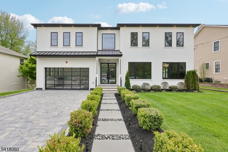 Welcome to a REFINED level of living in Paramus! This new luxury residence offers a seamless blend of elegance and functionality designed for those who value style, space and elevated living.From sunlit interiors-to refined architectural details every inch of this home is crafted to impress! Soaring 2- story ceiling height creates a dramatic sense of space and light. Custom built in 2024, the first floor is surrounded by floor to ceiling windows, the Custom Gourmet Kitchen with magnificent island offers top of the line Thermador s/s appliances. Formal  office with glass doors and warm wood panels allows for the perfect private work space. Every bedroom is thoughtfully designed as a private en suite offering ultimate comfort and privacy. Primary en suite w/FP,WIC and sauna! Finished basement is an entertainer's dream, w/dedicated movie theater, billiard room and lounge w/FP perfect for hosting unforgettable gatherings or enjoying a true cinematic experience at home. BR ensuite with egress window also on lower level for those guests that just don't want to leave! Stately manicured fenced in property with BRAND NEW deck with extended covered area and patio with seating and fire-pit for cozy summer or winter evenings! Thoughtfully landscaped with premier outdoor lighting illuminating the yard without overwhelming.Underground sprinklers. Close to schools,NJ Transit buses and park and ride to NYC, Rt 17, Rt4 and all the shopping and restaurants this wonderful town has to offer.