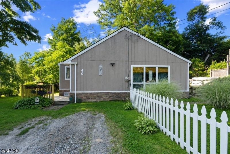 Welcome to this charming Ranch offering the perfect blend of comfort and functionality. This inviting home features 2 bedrooms plus a versatile bonus room, ideal for a home office, guest room, or playroom.The open-concept layout creates a bright and welcoming atmosphere, seamlessly connecting the living, dining, and kitchen areas perfect for everyday living and entertaining. Step outside to enjoy the spacious deck overlooking the backyard, providing the ideal setting for outdoor dining, relaxing, or hosting gatherings. Conveniently located near the lake and sandy beach, as well as Vernon Valley Ski Resort and Mountain Creek, this home offers year-round recreational opportunities, from swimming and boating in the summer to skiing and snowboarding in the winter. Whether you're looking for a full-time residence, a weekend getaway, or an investment property, this is the home that you won't want to miss!