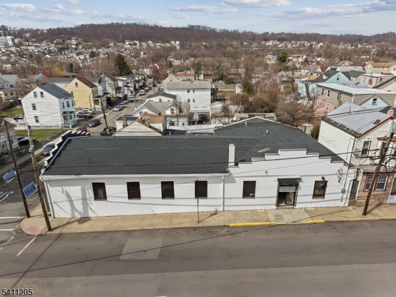 Freestanding Corner Warehouse with Drive-In Dock, Office, Basement & New Sprinkler System.Exceptional opportunity to own a versatile warehouse located on a 50x100 corner lot in Paterson. This well-equipped property features a drive-in loading dock, private office space, two restrooms, full basement for additional storage, and newly installed sprinkler system. Ideal for contractors, plumbing/HVAC businesses, electrical companies, e-commerce operations, light distribution, storage use, or owner-user headquarters. Functional layout allows separation of office and operational areas. Corner location provides accessibility and added exposure.Located in an R-3 zone. Buyer responsible for conducting their own due diligence regarding zoning and permitted uses.Rare opportunity for owner-operators or investors seeking flexible industrial-style space with valuable upgrades already completed.