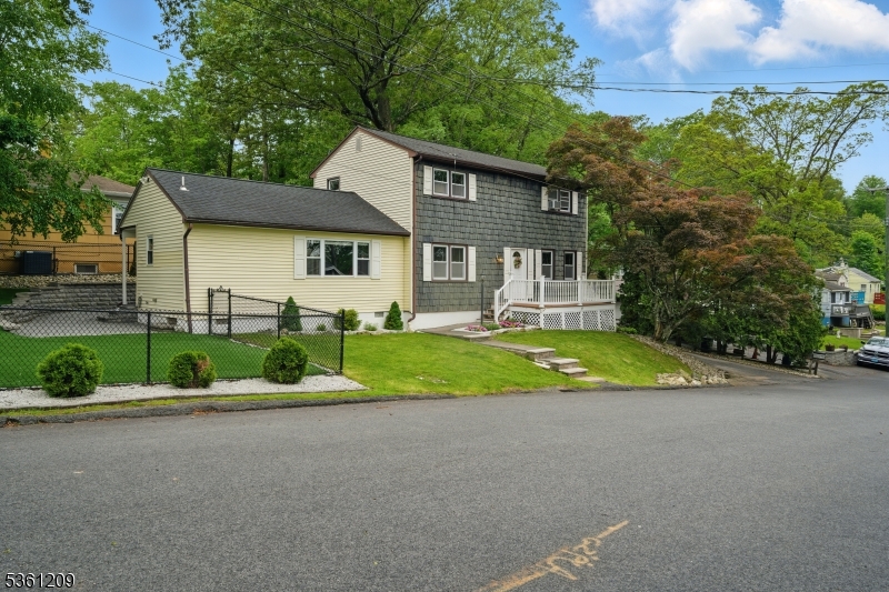 Charming Colonial just a short walk to Shore Hill Country Club & Lake Hopatcong. Move right in, just in time for summer. Shows pride of ownership. Lots of Generous Room Sizes to Spread Out & Make Your Own! Cozy living area with electric fireplace. Country Kitchen opens to dining area. Large family room with sliders to the patio and yard. 1st Floor Laundry & powder room. 2nd Level Offers 3 LARGE Bdrms & a Full Bath. Tons of Storage throughout, closets, attic, basement and garage!! Large paver patio- Perfect for Entertaining & Relaxation! Artificial grass makes this property LOW MAINTENANCE! Fenced in yard. Enjoy life on the NJ's Largest Lake - Boating, fishing, restaurants, ets! Easy access to highways. NATURAL GAS.