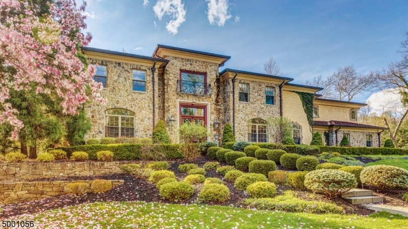 Best of the Best! Custom built to highest specifications for builder's own family, 9' high ceilings, detailed & quality craftsmanship are evident throughout! Radiant heated Santos Mahogany floors throughout 1st floor & heated floors in all bathrooms on 2nd floor. Stunning magazine-worthy dramatic 22' grand entrance hall & floating staircase open to grand dining room & living room. Family room open to spectacular gourmet eat-in kitchen w/ Wolf, Miele & SubZero appliances, granite counters & custom cabinetry. Handsome 1st level office! Luxurious master suite w/ FP, massive WIC, spa-like master bath w/ Carrara marble heated floors, jetted tub & oversized shower. 4 more bedrooms, 3 baths & a laundry room complete 2nd level. Lower Level w/ rec room & full bath. Patio & outdoor FP! Walk to Glenwood & the Train!