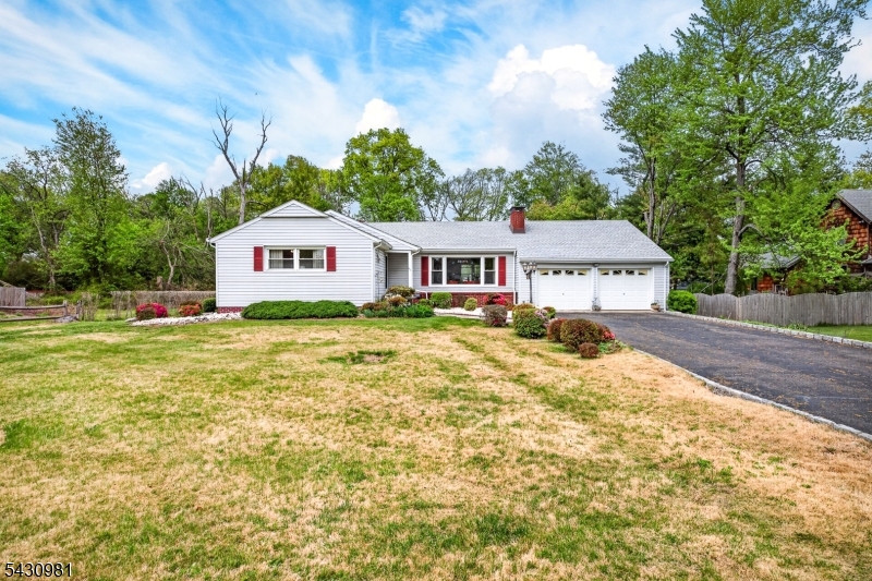 Ultra clean ranch with 2 car garage, sunroom, wood burning fireplace, rear patio, whole house generator, full basement with professional waterproofing and Bilco door, formal dining room. Possibility of a second lot subdivision. Paper street on left side to provide access to rear lot.