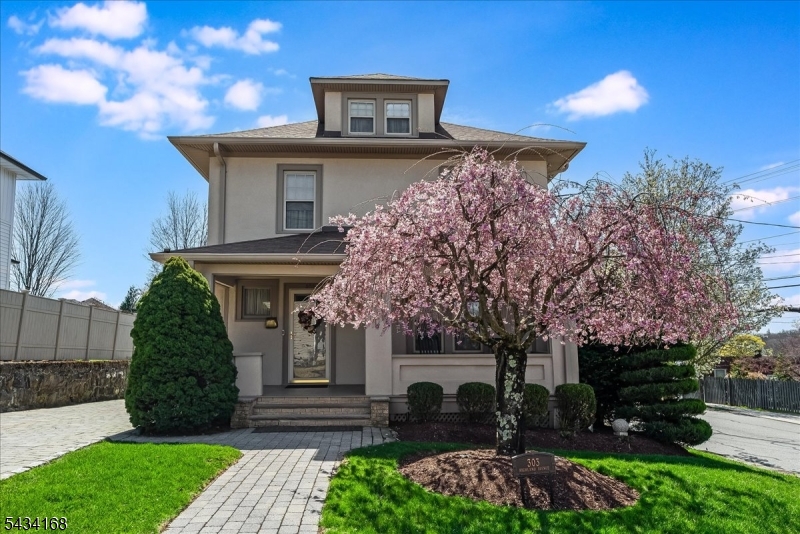 Welcome to a meticulously maintained Custom Colonial in the Hill Section of Boonton. This home boasts upscale living, designer-level finishes, and exceptional curb appeal in one of Boonton's most desirable neighborhoods. A charming front porch, professional landscaping, fenced-in yard, paver driveway & pathways, and exterior uplighting create warm first impressions. Inside, this 4-bedroom+office, 2.5-bath home showcases beautiful natural light and flowing layout for both everyday and holiday. The spacious main level invites living and dining spaces: a beautifully appointed kitchen with Thermadore appliances and a Sub-Zero refrigerator/freezer, a warming drawer, a Trex side deck, and a back room addition that can be used for recreation, or as a first floor bedroom. Upstairs has 3 generously sized bedrooms, including a primary suite + an office/potential 5th bedroom, that provide comfort and versatility. Below, a walk-out basement transforms into additional potential for storage, fitness, media space, crafts, or extended entertaining options with direct outdoor access. Addition wing has supplemental ductless split units (upstairs heat+cool, downstairs cool). Generac Generator powers entire home. Ring Doorbell. Conveniently located near downtown Boonton shops, restaurants, parks, major highways, and NJ Transit access, this exceptional property blends timeless style with modern convenience. Come experience all that 303 Highland Ave has to offer in Boonton: Small Town, Big Heart.