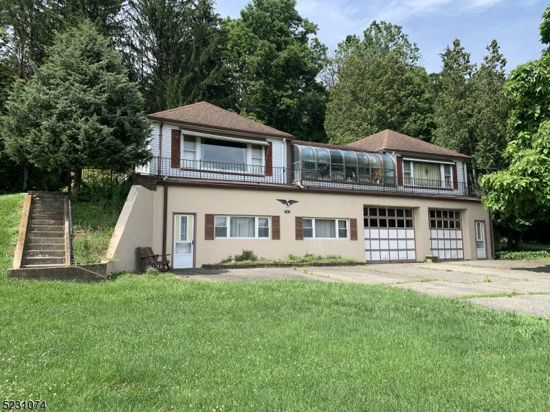 Calling all investors! Bring this 4 bed 2 bath home back to its full potential. This home boasts a beautiful solarium, 2 oversized garages, large master bedroom and size-able back deck perfect for entertaining. In-law suite in the basement features its own bedroom, living room, dining room, and kitchen. Home and pool are being sold totally as-is/where-is. Seller is in the process of removing personal items from the home, but buyer will be responsible for all other items left behind. Cash or Reno loan offers only! Buyer responsible for all inspections and C/Os. Priced to sell!