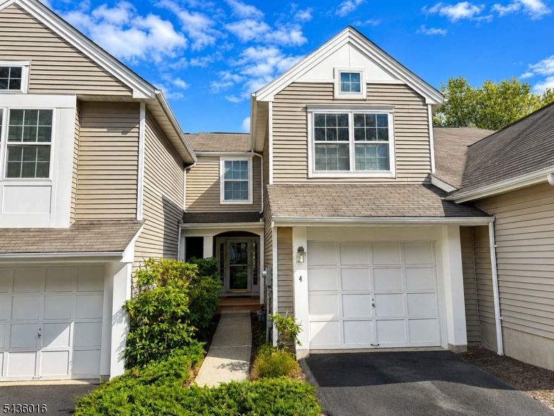 Welcome to Woodmont at Randolph, one of Morris County's most desirable townhome communities, surrounded by mature woodlands, beautifully maintained landscaping, and a peaceful neighborhood setting. This spacious two-bedroom, three-and-one-half-bath townhome features an open floor plan designed for comfortable living and entertaining. The sun-filled living room offers a soaring cathedral ceiling and fireplace, creating a warm and inviting atmosphere. The large kitchen flows seamlessly into the dining and living areas, while sliding glass doors lead to a private deck overlooking scenic surroundings. Upstairs, you'll find two generously sized bedrooms, including a primary suite with a walk-in closet, plus a versatile loft ideal for a home office, reading area, or flex space. The fully finished walk-out basement with a full bathroom provides additional living space perfect for recreation, media, fitness, guests, or hobbies. Additional features include a level-entry attached garage with direct access, a separate laundry area, natural gas heat, central air conditioning, and ample guest parking. Residents enjoy a community playground, peaceful walking and biking opportunities, and convenient access to shopping, dining, entertainment, parks, and major commuter routes, including NJ Transit service to New York City. Located within the highly regarded Randolph Township School District, this exceptional home offers the perfect combination of comfort, convenience, privacy, and community.