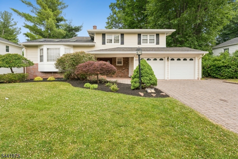 Welcome Home! This updated split level home features 4BR 2.5 baths. Both the kitchen and DR have been extended in 2006 renovation. Kitchen features granite counter tops, lrg center island 2 dishwashers, 3 sinks, built in microwave, refrigerator, 5 burner gas cooktop, 2 built-in ovens, and wine refrigerator. The LR and DR have new skylights and lrg windows. The family room has a beautiful built-in cabinet unit and a gas fireplace. Bonus study/office with built in desk. Paver walkways, driveway and patio. Full house generator  and underground sprinkler system included. Conveniently located near the golf course and houses of worship. Easy commute to NYC.