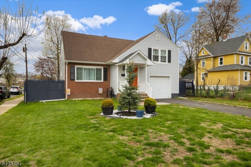 Turn-Key Excellence on a prime Corner Lot! This meticulously maintained split-level is packed with high-ticket upgrades for a total peace of mind: Brand New Windows (2024, transferable warranty), New High-efficiency Boiler (2024), New Siding and modern Portico (2022).The sun-drenched main level features gleaming hardwood floors and an eat-in kitchen with direct access to a private deck and backyard - perfect for entertaining. Upstairs offers two generous bedrooms, an oversized primary bedroom, and an updated bath. The finished basement provides incredible flexibility for a home office, rec room, gym, plus a second full bath and laundry.Commuter's Dream Location: Just one block to the NYC bus and minutes from major highways,shopping, and dining.Don't miss this move-in-ready gem-priced for an immediate sale!