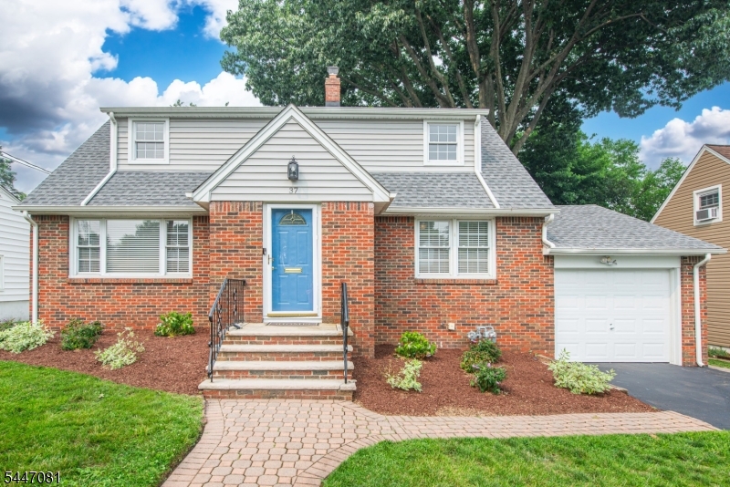 Welcome to this beautifully updated 3-bedroom, 2.5-bath Colonial Cape, where timeless architectural charm meets modern design. A gracious foyer opens to a sun-filled formal living room, offering an elegant setting for entertaining and everyday living. Just beyond, the inviting den features a built-in electric fireplace and custom entertainment center, creating a warm gathering space. The dining area and renovated kitchen showcase stylish finishes, updated appliances, and a layout designed for today's lifestyle. Flowing seamlessly from the kitchen is a tranquil sunroom overlooking the private backyard, perfect for morning coffee, casual gatherings, and year-round enjoyment. The outdoor setting serves as a private retreat ideal for al fresco dining, holiday celebrations, and relaxing evenings at home. Upstairs, the spacious primary bedroom offers a peaceful escape, while the generously sized second bedroom provides ample closet space. The updated second-floor bath features high-end, thoughtfully curated finishes. A first-floor bedroom adjacent to a full bath offers flexibility for guests, a home office, or a private suite. The finished lower level adds a family room, dedicated workspace, powder room, laundry area, abundant storage, and direct access to the garage. Additional highlights include hardwood floors, central air conditioning, and close proximity to parks, shopping, dining, schools, and NYC transportation.