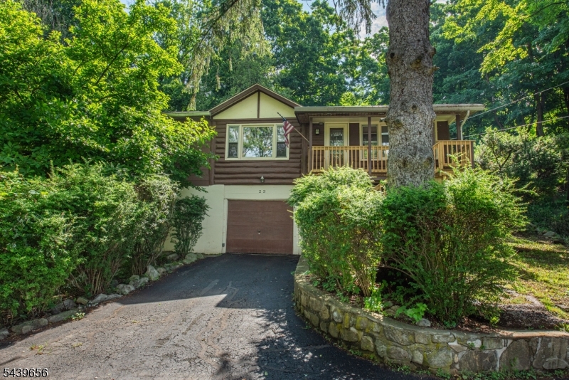Lake Stockholm living with room to breathe. Set on a double lot with a private backyard, this raised ranch offers character, flexibility, and a location that's hard to beat. Centrally located between both lake beaches, you'll enjoy easy access to swimming, fishing, and everything that comes with lake life.A newly finished front deck welcomes you inside, where oversized windows frame peaceful lake views and fill the home with natural light. The main living area features a freestanding wood-burning stove and skylights, while the adjoining dining room adds warmth and personality with room to entertain.The kitchen has been refreshed with stainless steel appliances, updated counters and backsplash, and overlooks the backyard, where you'll find mature landscaping including a beautiful Japanese maple. Step outside to enjoy the privacy of the rear yard, a rare find in many lake communities.The main level offers three bedrooms and a full bath, while the lower level provides additional finished space with its own entrance, full bathroom, laundry area, utility room, and garage. Whether you need space for guests, recreation, a home office, or everyday living, you'll appreciate the flexibility this layout provides.Just minutes from Route 23 and approximately one hour from NYC, this home offers the opportunity to enjoy a laid-back lake lifestyle without sacrificing convenience.