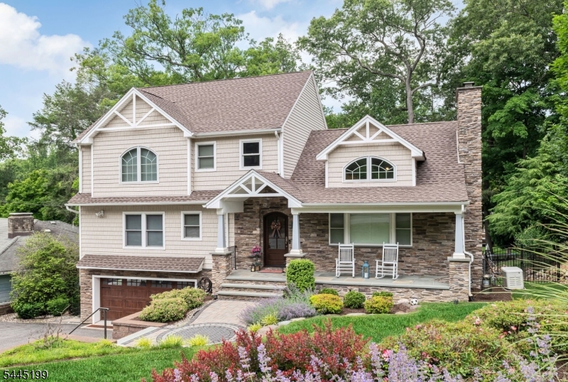 Welcome to 31 Osceola Road, an exceptional residence located in Wayne's highly sought-after Pine Lakes community, offering the perfect combination of modern luxury, smart-home convenience, and a true neighborhood lifestyle all within a 10-minute walk to the lake. Completely remodeled in 2017, this stunning home was thoughtfully redesigned with everything updated from that renovation, providing today's buyers with the comfort, style, and confidence of a truly move-in-ready property. Designed for both everyday living and entertaining, the home features custom cabinetry throughout the kitchen, primary bedroom, and upstairs bathroom, showcasing quality craftsmanship and attention to detail. The impressive primary suite includes a spacious walk-in closet and a beautifully appointed bath. Technology and convenience are seamlessly integrated throughout the home with a premium Sonos speaker system extending through the kitchen, living room, dining room, primary bedroom, primary bath, and outdoor deck creating the perfect atmosphere indoors and out. All bedrooms, the family room, and basement are equipped with infrared wiring for cable, internet, and TV connectivity. Additional premium features include a whole-house generator for year-round peace of mind and a heated two-car garage, new garage door, and showroom-quality epoxy floo.  This home delivers the rare combination of a modern fully updated home, premium upgrades, and the charm and lifestyle of Pine Lakes living.