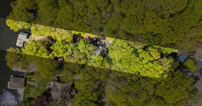 Set across 2 lots (8 Oneida Ave & 7 Riggs Ave + granted land) totaling over .50 acres, provides a rare opportunity to build your dream LAKEFRONT RETREAT in highly desirable No Wake Crescent Cove with stunning sunset views! Set on Lake Hopatcong, largest lake in NJ, this serene & secluded cove is an exceptional parcel offering the perfect canvas to bring your vision to life. The property captures breathtaking western exposure, delivering unforgettable sunsets & a tranquil waterfront setting ideal for both year-round living & luxurious weekend escapes. Enjoy swimming, kayaking, paddle boarding, & relaxing in calm waters of this protected no-wake cove without the disruption of heavy boat traffic. Opportunity to install a 4-bedroom septic system (approved by Sussex County Board of Health) allowing flexibility to design a custom home tailored to your lifestyle. With ample space & Hopatcong Land Use Board Approvals for a single-family home, 2-car detached garage, & boathouse (rare on the lake), you can create a seamless indoor-outdoor lake living experience. Imagine mornings on the water, afternoons boating & evenings unwinding as the sun sets over the horizon. Enjoy all that Lake Hopatcong has to offer, from vibrant waterfront dining & recreation to peace & quiet just a short distance from major highways, commuter routes & trains to NYC. Whether you envision a private getaway or a full-time residence, this is the time to secure prime lakefront land & build your dream. Survey, approvals & building plans are available upon request. THIS LOT IS SOLD WITH 7 RIGGS AVE MLS# 4028680.