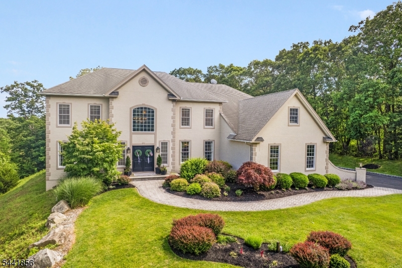 Experience unparalleled luxury in this extraordinary 5-bedroom estate. At the heart of the home is a magnificent sun-drenched chef's kitchen, designed for both everyday living & effortless entertaining. Featuring 2 dishwashers, a spacious walk-in pantry, & an expansive dining area, this stunning space seamlessly combines functionality with elegance. The spacious family room offers a warm, welcoming retreat, complete with a classic wood-burning fireplace. Host memorable gatherings in the formal dining room & relax in the inviting living room, filled with natural light. Each bedroom is thoughtfully appointed with its own private en-suite bath, offering exceptional comfort, convenience, & privacy. The luxurious primary suite serves as a private sanctuary, featuring a sitting room, a spa-inspired bath with soaking tub, dual water closets and an impressive walk-in closet!  A beautiful office provides the perfect place for privacy, work and study. The spectacular lower level is designed for recreation, wellness, & entertainment. Enjoy a private theater, expansive recreation & game rooms, office, gym area & full bath featuring a rejuvenating steam shower. Outdoor living is equally impressive - beautifully designed patio with outdoor kitchen, firepit gathering area, & sports court-creating the ideal setting for relaxation & entertaining alike. Completing this exceptional offering is a spacious 3-car garage &an unmatched combination of luxury, comfort, and lifestyle amenities.