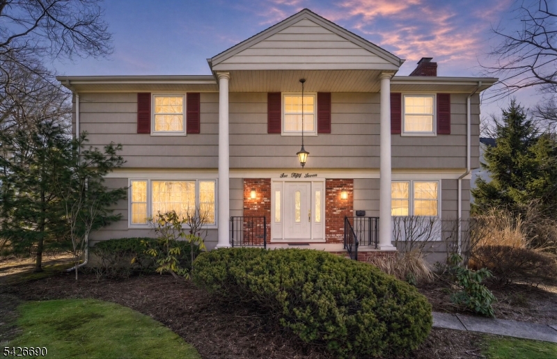 Brimming with character and set on a beautiful, nearly half-acre property in one of Glen Rock's most desirable neighborhoods, this classic 4-bedroom, 2.5-bath Center Hall Colonial offers exceptional space, timeless appeal, and endless potential. A stately exterior welcomes you into a traditional layout featuring spacious, light-filled living areas, a formal dining room, and a bright eat-in kitchen with ample cabinetry. The inviting family room showcases a floor-to-ceiling brick fireplace, while original details and hardwood floors existing beneath much of the carpeting add warmth and charm throughout. Upstairs, four well-proportioned bedrooms include a primary suite with its own bath. A finished basement provides flexible bonus space for recreation, a home office, a workout area, or hobbies. Outside, enjoy an expansive deck for al fresco dining, a detached 2-car garage, and a sprawling level yard with endless possibilities for entertaining, gardening, or future enhancements. Conveniently located near top-rated schools, parks, and NYC transportation, this is a rare opportunity to personalize and reimagine a thoughtfully cared-for home in one of Bergen County's most sought-after communities.