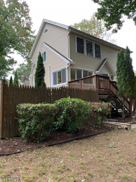 RARE FIND!  A RENOVATED & SPOTLESS, MOTHER-DAUGHTER COLONIAL/ CUSTOM HOME OFF THE LAKE.  THE 1ST FLOOR FEATURES A SPACIOUS LIVING ROOM, EAT-IN KITCHEN WITH GRANITE COUNTERS, GLASS BACKSPLASH, WAINSCOTING AND STAINLESS STEEL APPLIANCES, FULL BATHROOM, AND TWO BEDROOMS (ONE WAS USED AS LAUNDRY ROOM BUT CAN SWITCH BACK).  THE SECOND FLOOR FEATURES A 24' X 14' PRIMARY BEDROOM WITH 3 LARGE CLOSETS AND TONS OF WINDOWS.  2 ADDITIONAL BEDROOMS COMPLETE THE 2ND FLOOR.  THE LOWER LEVEL HAS ITS OWN ENTRANCE AND FEATURES ANOTHER EAT-IN KITCHEN, LIVING ROOM & DEN / BEDROOM WITH LOTS OF CLOSETS AND A FULL BATH WITH SHOWER STALL. THE UTILITY ROOM HAS ROOM FOR WASHER / DRYER HOOKUP.  THE OUTDOOR SPACE IS PERFECT FOR ENTERTAINING WITH A LARGE DECK, PAVER BLOCK PATIO, AND A WORKING HOT TUB BEING SOLD AS IS. THE 2-CAR DETACHED GARAGE IS OVERSIZED AND HAS LOTS OF SPACE FOR WORK BENCHES, PLUS ADDITIONAL STORAGE IN THE ATTIC, WITH PULL DOWN STAIRS. OTHER FEATURES IN THIS TERRIFIC HOME: RECESSED LIGHTING & CEILING FANS THROUGHOUT,  UPGRADED 300 TOTAL AMP ELECTRIC, GENERATOR HOOK-UP, BRAND NEW 275 GALLON ROTH TANK. PUBLIC WATER / SEWER HERE. GAS HOOK-UP AVAILABLE IN STREET. HOME IS ACROSS FROM THE LAKE! BEACH CLUB MEMBERSHIP NOT MANDATORY. THIS HOME IS A COMMUTERS DREAM--SUPER CLOSE TO ALL MAJOR HIGHWAYS, SCHOOLS, LAKE DINING, PARKS AND NYC TRANSPORTATION.