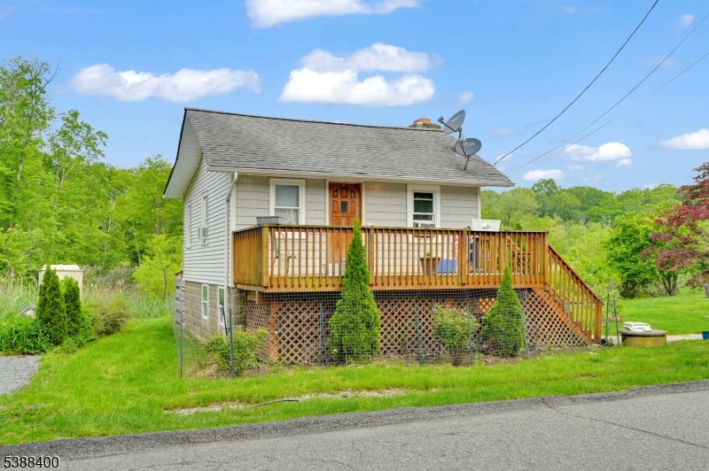 Cozy Upper Greenwood Lake Investment Property! Charming 2-Bedroom Cottage just a block from the beach and clubhouse! Enjoy the tranquil setting with a large yard backing to a stream   perfect for entertaining or relaxing outdoors. Currently tenant-occupied with a 2-year lease, this property offers immediate rental income and excellent investment potential. Don't miss your chance to own a slice of lake community living   schedule your showing today!
