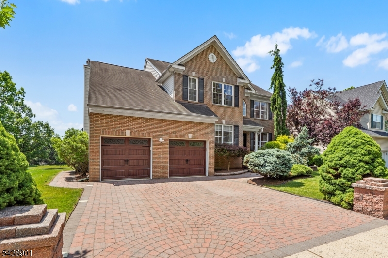 Welcome to Woodfield Estates, where this beautifully maintained 4-bedroom, 2.5-bath Colonial offers a prime location backing to open space for added privacy. This home features stunning curb appeal with professional landscaping, a paver driveway, walkways, & an expansive patio for outdoor entertaining. Step inside the impressive two-story foyer &  discover hardwood flooring, 9-ft ceilings, crown molding & updated lighting. The heart of the home is the light-filled gourmet kitchen & great room with soaring vaulted ceilings, marble flooring, 42" cabinetry, granite countertops, tiled backsplash, center island, beverage center, SS appliances, pantry, under-cabinet lighting, & French doors leading to the patio. The adjoining great room features hardwood floors, a wood-burning fireplace with custom wood accent wall. A private office with built-ins & electric fireplace, updated powder room, & mud/laundry room complete the main level. Upstairs, the primary suite offers a sitting area, WIC with custom organizers, & a spacious bath with dual sinks, soaking tub, & separate shower. Three additional generously sized bedrooms feature recessed lighting, ceiling fans, & custom closet systems. Additional highlights include a full basement with high ceilings, two-zone HVAC & tankless HWH replaced in 2023, electrical panel upgraded in 2024, whole-house surge protector & storage shed. A desirable neighborhood close to major commuting routes, shopping, dining, & Princeton-area amenities.