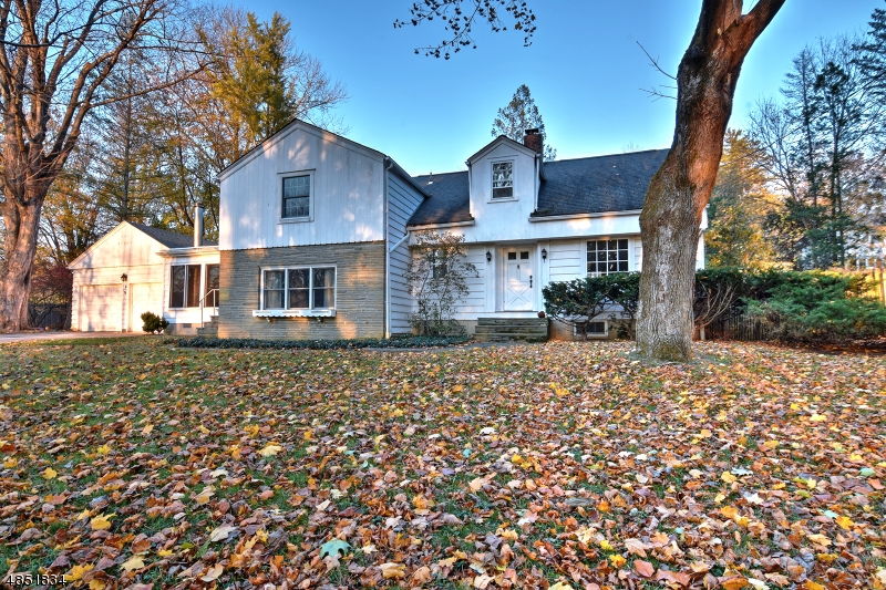 Wonderful colonial perfectly situated on a quiet street one block up from beautiful Lake Lenape with seasonal lake views. Take notice of the original oak flooring throughout just refinished and brought back to life and coated to withstand years of use!  Oversized rooms from an era gone by make this an exceptional home. Quiet, efficient and moist steam heat gently warms the home. Large picture windows overlook the well proportioned fenced rear yard. This solid built home boasts good bones and makes this property a perfect opportunity for a creative buyer to put their taste and style on this diamond in the rough! Close to shopping and commuting.