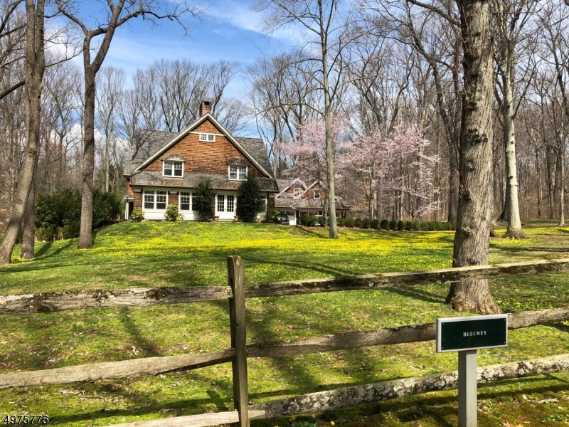 Gracious living on a private serene 3+acres in New Vernon, part of Harding. This colonial built in 2005 is part of Hartley Farms, a private community with walking trails and open space. This home has both an open kitchen family room and formal rooms perfect for day to day living and entertaining. There is a private first floor library, a basement board room office and a 2nd floor office with a built in desk. The master suite has cathedral ceilings, a spa like bathroom, and a large dressing room. There are 5 bedrooms, 4 full baths and a 2nd laundry on the 2nd floor. This home is minutes from downtown Madison, Morristown and Chatham. In the finished lower level there is a spa like marble bathroom, an entertainment room, gym, wine cellar and office. Imagine there are few reasons to leave the property.