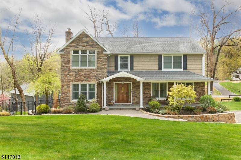 Stunning, custom built colonial with all of the modern features one could wish for!  This four bedroom, 3 1/2 bath home has hardwood flooring, high ceilings, huge finished basement with game room, fabulous office to work from home and upgrades galore!  Enjoy amazing views and entertainment options galore from the custom built patio with custom stone walls and outdoor kitchen with granite!  Bright, open kitchen featuring custom cabinetry throughout, granite countertops with double stainless steel sink and pull porcelain tile backsplash with decorative Mosaic tile.  Formal Dining Room with hardwood floors, recessed ceiling lights with tons of natural sunlight!  Living Room with a wood-burning fireplace with custom wood mantel and raised flagstone hearth.  Bedrooms feature all hardwood flooring. Porcelain flooring in master bathroom and a picture perfect tub/shower in main bath.  The three car garage Which is really a four car garage minus the door, is one of the many WOW'S this property has to offer!  This home truly encapsulates elegant living and beauty!  The addition which has walls of windows into the lower level is one of my favorite parts. Putting the addition on this home made it a master piece. Quality craftsman!!!!