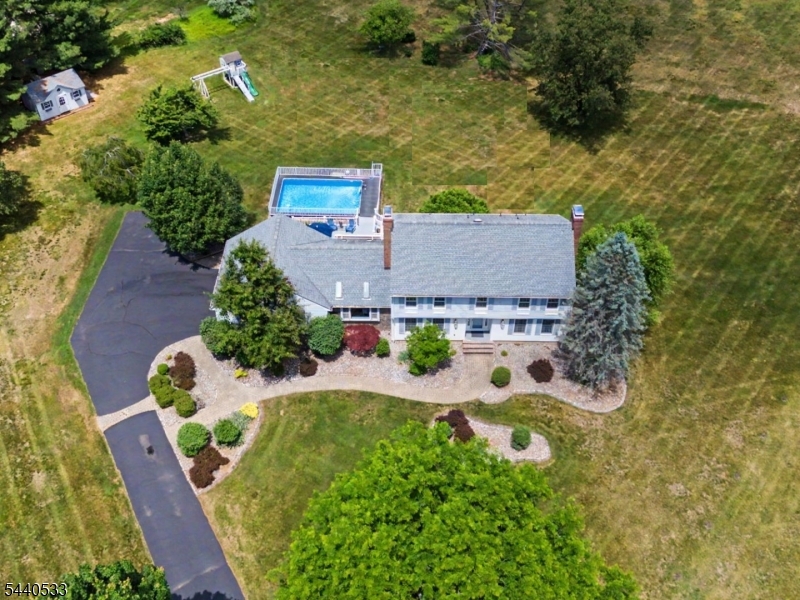 Situated on a premium cul-de-sac property with 1.89 acres of idyllic grounds, this handsomely updated and immaculate 4 BR, 2.5 BA center hall colonial is the one you've been waiting for! Special features include an updated gourmet kitchen with stainless steel appliances, solid-surface countertops and sunny breakfast area overlooking the spacious FR with vaulted ceiling with skylights, wood stove and glass door to the expansive deck with retractable awning, inground pool and amazing backyard! Swing set and shed are included. This main level also includes a graciously sized foyer, large LR with hardwood flooring & raised hearth masonry FP, Formal DR with hardwood flooring & wainscotting, chair rail & crown molding, Laundry Room & Updated Powder Room. Upstairs is the luxurious MBR with WIC & updated en-suite BA with frameless glass shower & elegant marble-topped double bowl vanity. There are 3 more BR's on this level along with a beautifully updated second full BA with double bowl vanity with marble countertop. Hardwood flooring runs throughout all of the BR's. The finished walk-out basement is an added bonus with a large Game Room, Gym and Craft Room. Updates include new roof (2016), New central air (2016) & New hot water heater (2018) & BRAND NEW SEPTIC system! (to be completed prior to closing)