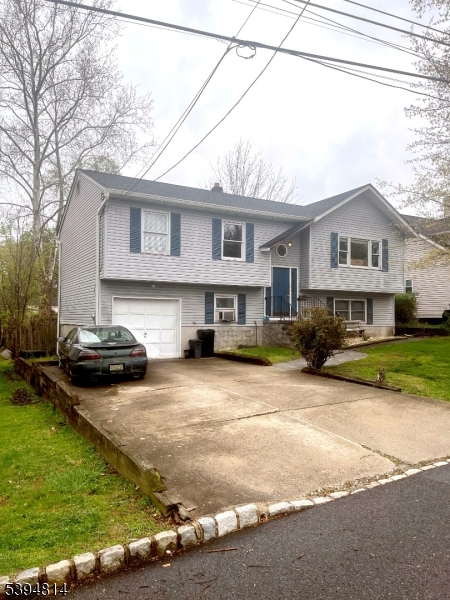 Split level with a second entrance on the ground floor which has it own bathroom. Hardwood floors throughout. Vaulted ceilings in living room, dining room and kitchen. Property being sold "as is."
