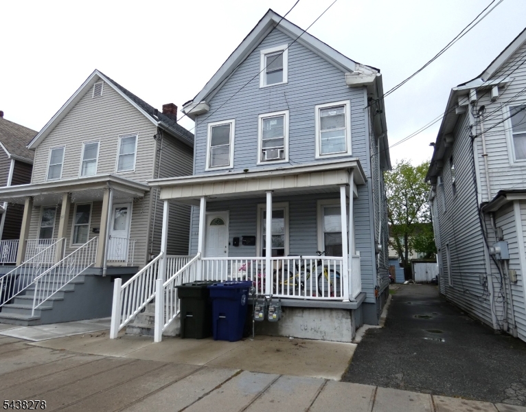 Amazing large 2 Family Money Maker. Low Taxes. Separate Gas, Electric & Water Meters. North East Facing. 1st Floor Apartment has 2 Bedrooms, Living Room & Eat In Kitchen. 2nd Floor Apartment has 3 Bedrooms, Living Room & Eat In Kitchen. Plus 2 Bonus Rooms in Attic. 2 Car Detached Garage (rented for $300). Parking for 4 Cars (2 spots rented for $100). 1st Floor rent is below mkt. Potential Total Rental Income of $64,800. Cap Rate 8%. All Utilities paid by Tenants. Great for Commuters, Perth Amboy Train Station with Direct Trains to NYC is just a short 12 minutes walk.
