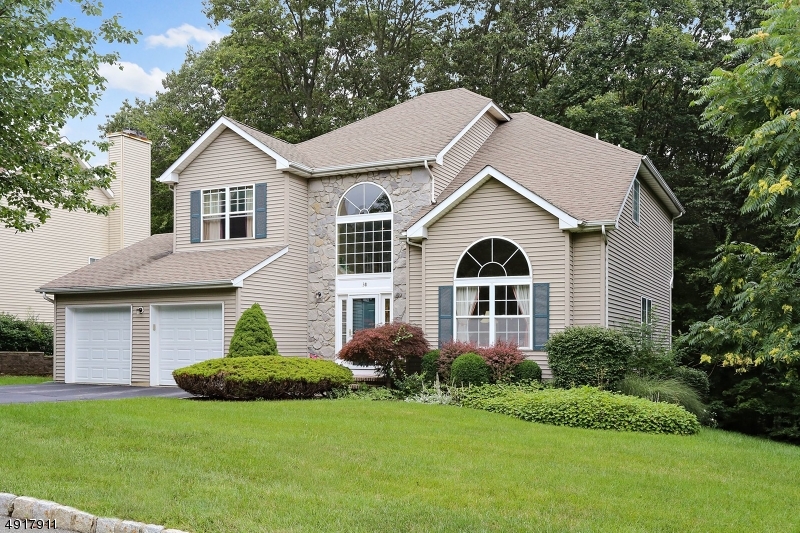 IMMACULATE & MOVE IN READY! SITUATED ON A TREELINED LOT, THE BEAUTY FEATURES AN OPEN FLOOR PLAN, TWO STORY FOYER W PALLADIUM WINDOW THAT OPENS TO FORMAL LIVING RM W  CATHEDRAL CEILING & DINING RM. UPDATED KITCHEN FEATURES GRANITE COUNTERTOPS, SKYLIGHTS AND FRENCH DOOR THAT LEADS TO LARGE DECK. FAMILY ROOM IS ADJACENT TO KITCHEN AND FEATURES A WOOD BURNING FIREPLACE. SECOND FLOOR HAS FOUR BEDROOMS INCLUDING A MASTER SUITE WITH TRAY CEILINGM LARGE BATH &  WALK IN CLOSET. WALKOUT BASEMENT OFFERS LOTS OF POTENTIAL FOR ADDITIONAL LIVING SPACE. PUBLIC UTILITIES & CONVENIENTLY LOCATED MINS TO ROUTES 10, 46, 80 & 206.