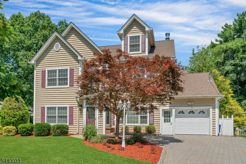 Welcome to 44 Ellers Drive, where timeless elegance meets modern living in one of Chatham's most coveted neighborhoods. This 5 bedroom, 3 full bath house offers a wonderful opportunity to own a property in the heart of town. This impressive residence offers over 3,700 square feet of thoughtfully designed living spaces. Three floors of graciously scaled rooms, rich hardwood flooring, high ceilings, and an effortless flow designed for today's lifestyle. The first floor entry foyer leads into a spacious living room with marble fireplace. A dining area, family room,  gourmet kitchen featuring custom cabinetry, Thermador stainless steel appliances, a large center island, and a pantry. The house features two bedrooms and full bath on the first floor, perfect for guests or office. The second floor boasts a large primary suite with walk in closets and bonus room. Two additional bedrooms, another full bath, and laundry are on this level. The third floor recreation spaces are large and offer a level of sophistication and functionality. You will also find a bonus room that can be used as a bedroom or office. A beautiful fenced backyard and patio with gas connection offers endless possibilities for outdoor dining, recreation, and gardening. Conveniently located near schools & town. Chatham direct train to NYC.  Additional highlights include a whole house generator, chandelier lift, whole house Aqua-sauna water filtration system, smart thermostats, Bose surround sound, and Tesla charger.