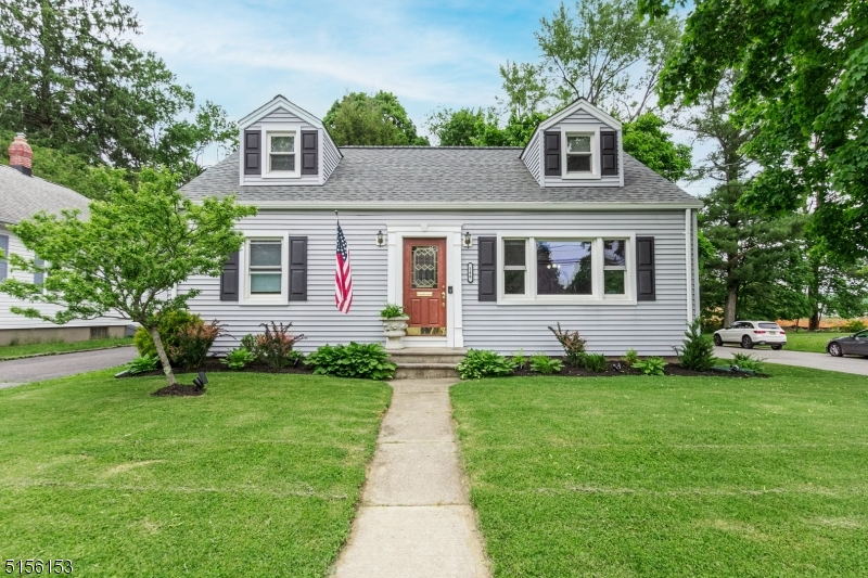 This charming 4-bedroom 2 full bath cape cod home sits on a quiet, tree lined street, in a highly desirable section of town. The updated kitchen is open to the light and bright living room with hardwood floors. The entertainment size deck, looks over park like property. The desirable in town location makes it perfect to stroll to the many restaurants, microbreweries, shops and more!