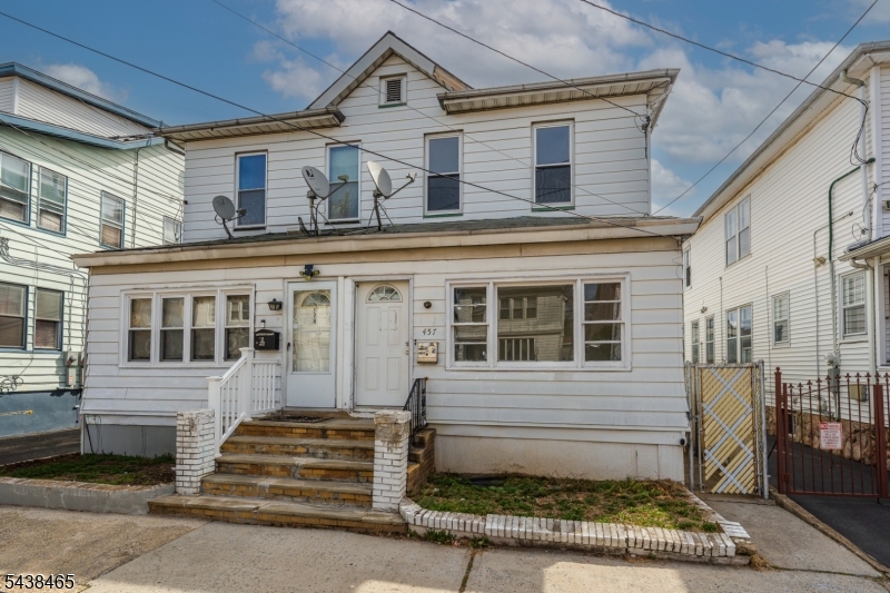 Opportunity meets location on Newark's desirable North Side! This duplex-style single-family home offers incredible potential for the right buyer looking to add value and make it their own.The main level features a spacious living room, formal dining room, and an eat-in kitchen, along with a full bath conveniently located on the first floor. Upstairs, you'll find three bedrooms and an additional full bath, providing a practical and flexible layout. This home also features new windows, bringing in great natural light and adding to the overall value. Enjoy the charm of an enclosed front porch perfect for relaxing or creating a welcoming entry space along with a nice-sized, low-maintenance cement backyard ideal for outdoor seating or entertaining without the upkeep. A partially finished basement offers additional space for storage, recreation, or future customization, while the detached garage provides convenient parking and extra storage. The property does need TLC, making it a great opportunity for investors or buyers looking to renovate and build equity. With the added benefit of low taxes, this home becomes an even more attractive long-term investment. Ideally located just 0.3 miles from the Bloomfield Light Rail Station and only about a 10-minute drive to Newark Penn Station, this home is perfect for commuters seeking accessibility and long-term upside.