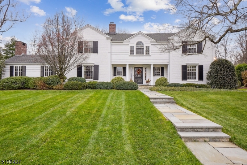 Classic Brick and Wood Shingle Colonial  sits on 1/2acre of manicured grounds.  Great location, walk to schools and downtown.  Four Bedrooms, 3 full and 2 half baths, Gourmet Kitchen with center island, high end appliances, desk area and wet bar with wine refrigerator. Sitting rooms on 1st & 2nd floors.  Fabulous screened porch for indoor/outdoor entertaining leads to level yard and patio.  Lower level includes Recreation Room, Exercise room ,powder rm and Laundry .  Charms galore