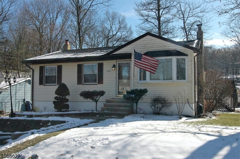 CHARMING & WELL MAINTAINED RANCH SITUATED ON A LARGE CORNER, FENCED LOT FEATURES NEW STAINLESS STEEL APPLIANCES, NEW HOT WATER HEATER & CENTRAL AIR CONDITIONING. LIVING ROOM & BEDROOMS HAVE WOOD FLOORS. BATHROOM WITH A NEW VANITY & KITCHEN HAVE SKYLIGHTS THAT BRING PLENTY OF NATURAL LIGHT. 3 SEASON SUNROOM WITH WOOD BURNING STOVE IS OFF THE KITCHEN ADDS NICE INTERIOR SPACE TO THE HOME. THE SPACIOUS WALK OUT BASEMENT FEATURES A WOOD BURNING STOVE GREAT FOR THOSE LONG COLD NIGHTS AND ENTERTAINING. THE UTILITY ROOM/ LAUNDRY ROOM PROVIDES EXTRA SPACE FOR STORAGE. MAKE THIS YOUR HOME TODAY! PUBLIC WATER & PUBLIC SEWER.