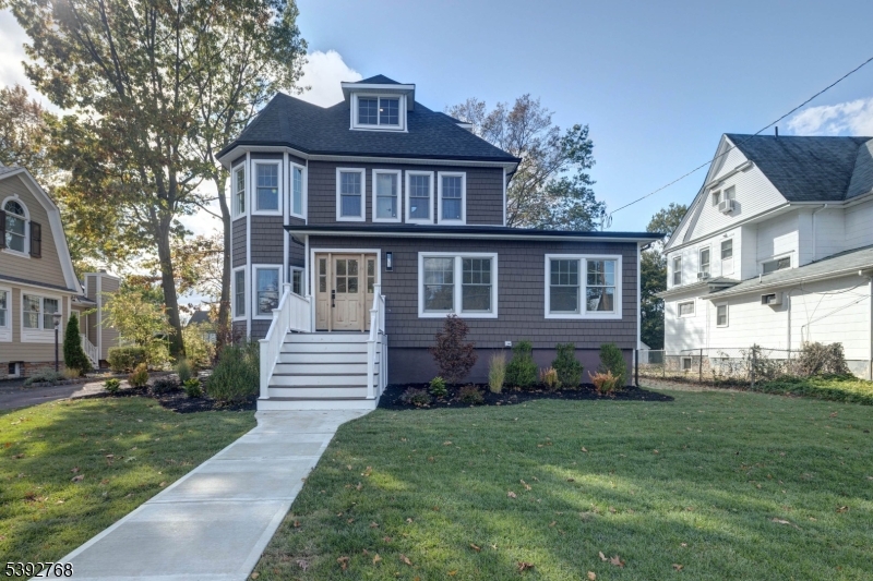This magnificent and stately home has been transformed with a 2-story addition and total renovation, and sits less than half a mile from the Westfield NJ Transit Station. The living space includes a chef's kitchen with a Thermador appliance package with a 48" range and 48" refrigerator. and 11' long oversized island. The kitchen flows into a sun-drenched family room, where the centerpiece will be a gas fireplace (to be installed/backordered). The adjoining open-concept dining room and living room provide endless possibilities for your interior design. Completing the first floor are a guest suite, with full bath and walk-in closet, a home office, powder room, as well as a walk-in pantry with sink and a beverage center. On the second floor, the primary bedroom features a full bath with a custom shower and a soaking tub, as well as a massive walk-in closet (seller will provide an allowance for customization). Also on the second level, you'll find a junior suite with a full bath, as well as 2 more bedrooms with a shared hall bath, and a laundry room. The finished third level offers another bedroom or recreation room, as well as another full bath. New 2-zone heating and air conditioning for your comfort, and an new tankless/high efficiency water heater. Outside you'll find new CertainTeed Cedar Impressions siding, a new roof, new Andersen windows. The new 16x16 paver patio overlooking the deep back yard is perfect for outdoor entertaining. Bottom portion of driveway is shared.