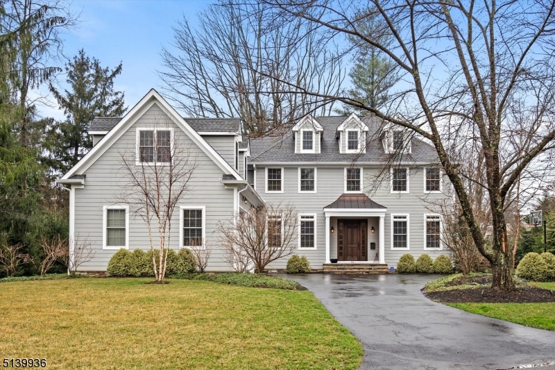 This gorgeous home, located in the prized neighborhood of Riverside, offers an easy stroll to Riverside Elementary School and popular Nassau Street. The house is a stylish, traditional Colonial with modern features and a bounty of elegance and charm.  What distinguishes the home is the superior quality of construction, the attention to detail, contemporary interior design and the sumptuous finishes throughout--high ceilings, oversized moldings, deep sculpted archways, brilliant light fixtures, burnished hardwood floors and over-sized windows.  The first floor boasts a cozy living room with fireplace and a formal dining room with coffered ceiling and grand chandelier, plus an office/or first floor bedroom with an adjacent full bath. The spacious family room leads to the kitchen with high end cabinetry & fixtures, quartz countertops, top-of-the line appliances, extraordinary range hood and walk-in pantry. A covered outdoor patio features a wood-planked ceiling and fan.  Off the kitchen is a  mudroom with a half bath leading to an oversized 2-car garage.Ascend the stairs to the primary bedroom with cathedral ceiling, wood paneling and spacious walk-in closet, plus elegant primary bath. One en-suite bedroom with its own private bath.  There are two additional bedrooms . Down the hall is a large bonus suite with kitchenette, and bedroom with private bath.  On the lower level, the finished basement has ample space for a media room, play room and exercise room.