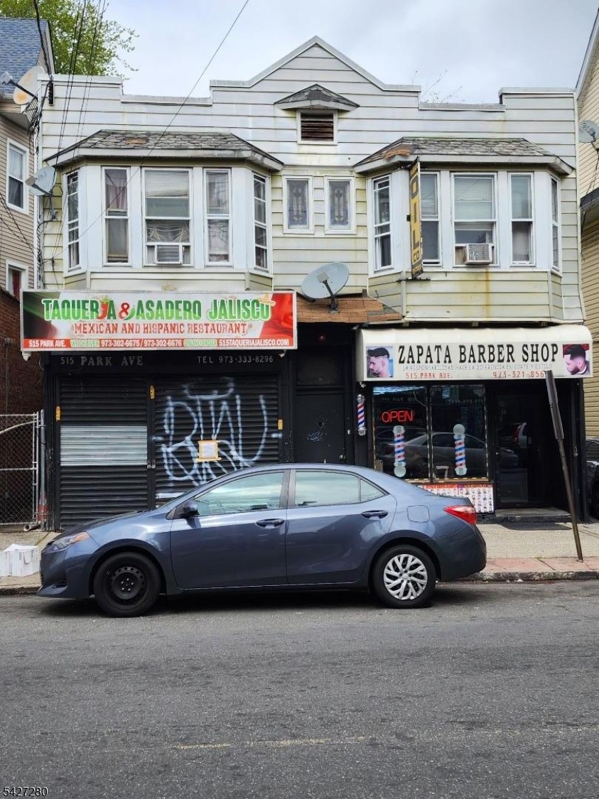 INCOME PRODUCING PROPERTY. SEPERATE HEAT & ELECTRIC. LOCATED IN A HIGH TRAFFIC AREA. ROOF IS APRX 10 YEARS OLD. 2 UNITS ON THE 1ST FLOOR CONSISTING OF A RESTAURANT & BABER SHOP. 2 - 3 BEDROOM APTS ON THE 2ND FLOOR.