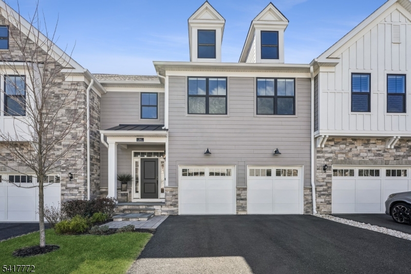Experience elevated living in this exceptional modern Eldon Model multi-level luxury townhouse, offering 3 bedrooms, 3 full bathrooms, and 1 half bath. The sun-drenched open-concept main level is an entertainer's dream, featuring a spacious family room, elegant dining area, and a gourmet kitchen with a center island, premium Jenn Air appliances, and a built-in wine refrigerator. Light-toned wood flooring flows throughout, while seamless access to a private walkout deck creates an effortless indoor-outdoor lifestyle. The upper level showcases a serene primary suite with a spa-inspired en-suite bath and dual custom walk-in closets. Two additional bedrooms, each with walk-in closets and custom shelving, are complemented by additional full bathrooms. A versatile loft provides the ideal space for a lounge, home office, or media area. The fully finished basement includes a full bathroom and generous storage space, offering exceptional flexibility for a recreation room, guest suite, or private retreat. The family room features a custom built-in bookshelf, adding warmth and character. Additional highlights include a two-car attached garage, soaring ceilings, and curated contemporary finishes throughout, delivering a residence that perfectly blends luxury, sophistication, and effortless living.