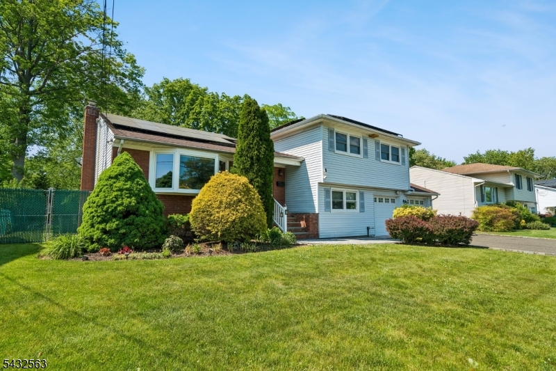 Located in a prime location, this spacious and well-maintained split-level home offers 5 bedrooms, 3 full baths, and a 2-car garage with the perfect blend of comfort, convenience, and energy efficiency. Featuring a large rear addition, this home provides generous living space ideal for entertaining, working from home, or extended living arrangements.Enjoy outdoor living with a beautiful deck, patio, fully fenced backyard, and storage shed. Additional features include central air conditioning, 2-zone heating, water softener system, and washer & dryer included with the sale.This energy-efficient home comes equipped with an owned solar system saving approximately $2,000 annually on electricity, plus an additional 7 years remaining on valuable state solar credits averaging about $1,500 per year.Conveniently located close to schools, Houses of Worship, shopping centers, Newark Liberty International Airport, and major highways, making commuting and everyday living easy and accessible.A rare opportunity to own a spacious home in a highly desirable location with outstanding value and long-term savings!