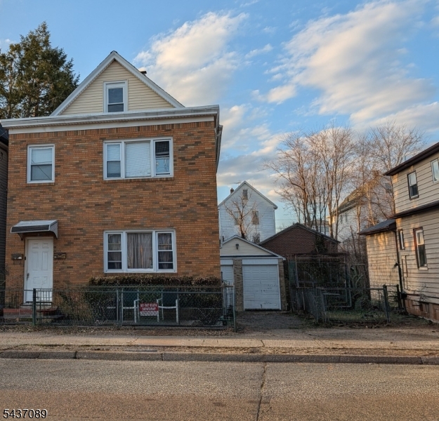 Exceptional investment or owner-occupant opportunity in Garfield! Situated on a desirable double lot, this well-maintained two-family home offers a private driveway with ample off-street parking leading to a detached 2-car garage. Each unit has separate utilities and benefits from newer roof, windows, and carpeting. The first-floor apartment features 1 bedroom, while the second-floor unit offers 2 bedrooms plus finished 3rd-level bonus rooms, ideal for additional living space, home office, or recreation. Walkout basement provides added storage and functionality. Tenant occupied and being sold as-is. Perfectly located for commuters, just minutes from NJ Transit train and bus service with convenient access to Routes 46, 80, 21, and the Garden State Parkway, making travel to NYC and surrounding areas a breeze. Close to shopping, restaurants, schools, parks, and local amenities. Whether you're looking to expand your investment portfolio or occupy one unit while generating rental income from the other, this versatile property offers outstanding potential in a prime Bergen County location.
