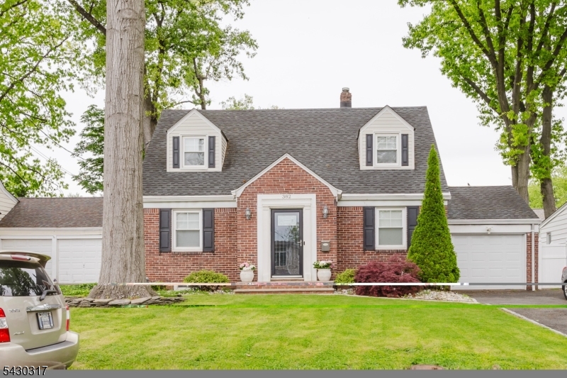 Welcome to this charming 3 bedroom Cape Cod located on a beautiful tree-lined street. Enter through the foyer into a bright living room and formal dining room leading to a huge completely updated extended eat in kitchen featuring quartz countertops, white cabinetry with gold hardware a breakfast bar with sink and stainless steel appliances including dishwasher, stove & gas range. Sliders off the kitchen lead to a 12x18 trex deck overlooking a nicely fenced yard with white 6' PVC  fencing & storage shed-perfect for outdoor entertaining.  Main bathroom is tastefully renovated with beautiful tile tub/shower and floors, white cabinetry and illuminated vanity mirror. The fully finished basement provides additional living space with a family room, full stall shower bathroom, new laminate wood flooring, a laundry area, and utility room. Additional highlights include replaced vinyl windows, recessed lighting, ceiling fans, crown moldings, high velocity central air system with larger ceiling vents on the second level, a gas furnace and hot water heater approximately 3 years young, and a 30 year timberline roof. Exterior features include a 2 car wide blacktop driveway and an attached garage. You will not be disappointed in this move in lovely home!!