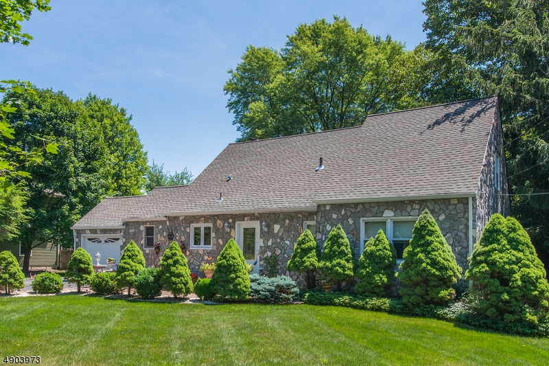 Beautiful, Sprawling, Expanded Cape! Fabulous Floor Plan. Mountain Lakes School System. Bright, Sunny Eat-In-Kitchen w/ Granite Counters & SS Appliances.  Brick Faced Fireplace in formal Living Room & French Doors to Sitting Area. Large, Welcoming Foyer! Gorgeous HW flooring & solid custom wood doors throughout. Handy mud by 1-car garage access. 3 generous sized bdrms equipped w/ lots of closet space. 1st floor BDRM. 3 Full baths. Flexible Finished Space in BSMT- In Law Suite Potential w/ 4th bdrm & full bath. BONUS FR. Situated in a lovely neighborhood on over 1/2 acre of level property. Stunning Backyard Oasis Perfect for Entertaining & Relaxation! Enjoy the Privacy & peacefulness of rural Boonton Twp. just mins from Denvilles bustling DWTN, NYC-Direct transport & major hwys. Award winning school system