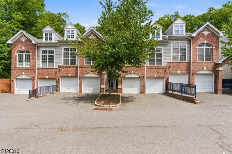 Nestled in a quiet, lush setting with breathtaking views of the 2,000+ acre Watchung Reservation, this meticulously maintained Northwest facing (please verify) 2 bed, 2.5 bath townhome offers the perfect blend of comfort, convenience, and modern upgrades. The sun-drenched living room features soaring ceilings, oversized windows, and a cozy gas fireplace, creating a warm and inviting atmosphere. The kitchen offers granite counter tops, newer LG stainless steel appliances and a breakfast bar. Upstairs you'll find a spacious primary suite which includes a custom designed walk-in closet and a balcony to enjoy the beautiful views of the reserve, the laundry room for added convenience, and a versatile loft that provides the ideal flex space for a home office, gym, or lounge area. All this plus the home is thoughtfully equipped with premium upgrades including a complete Ring home security system (close to $1,000 in value), advanced reverse osmosis water filtration, and a 240-volt outlet for EV charging in the attached garage. Enjoy a newer washer/dryer and a newer HVAC system for added peace of mind. Ideally located just off Route 22 and near Interstate 78, this home offers easy access to NYC via train, bus or car, while being moments from the vibrant downtowns of Scotch Plains and Westfield with shopping, dining, and parks nearby. Situated within the the highly ranked Scotch Plains school district and conveniently adjacent to guest parking, this exceptional home truly has it all.