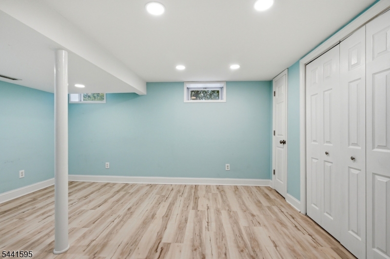 Nestled in the heart of Madison, this charming Cape offers the opportunity to enjoy one of Morris County's most desirable communities. Just minutes from downtown Madison's wonderful restaurants, charming shops, parks, and train station, you'll appreciate everything this vibrant town has to offer. Situated on a lovely corner lot, this home welcomes you with freshly painted neutral decor and abundant natural light throughout. The sun-filled living room flows nicely into the updated eat-in kitchen, creating an open feel to the main living area. Whether you envision a quiet place to read, work from home, or simply unwind, the sunroom is ready to become one of your favorite rooms in the house. The finished basement provides additional living space that's perfect for a home office, game day, hobbies, or whatever best fits your lifestyle. Hardwood flooring, recessed lighting, a newer roof, newer windows, newer siding, and plenty of storage are just a few of the additional features this home offers. Outside, the nicely landscaped yard and flowering trees create a peaceful setting to enjoy throughout the seasons. Whether you're enjoying downtown Madison, everything this wonderful community has to offer, or simply relaxing at home, you'll quickly see why so many people love calling Madison home.