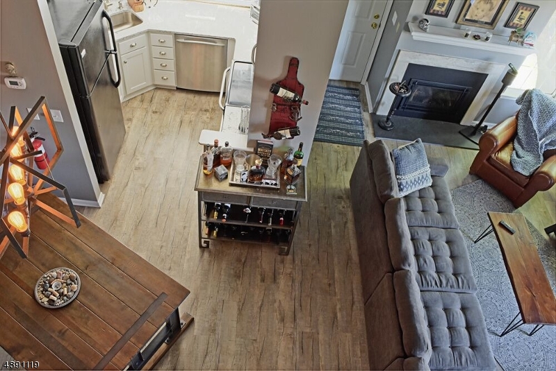 Everything brand new Kitchen flooring, light fixtures gas fireplace and freshly painted 2 story Living Rm Fantastic community pool tennis courts clubhouse and gym Easy commute to NYCity 80, 287 and 78