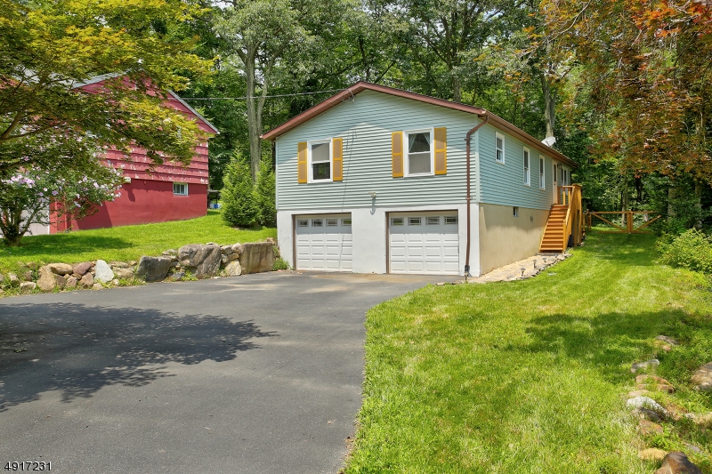 Expect to be impressed! 4 BRs, 3 full baths, updated kitchen, new appliances, newer wood-like floors, 2 new bathrooms, 1 updated bath, newer 2 zone gas furnace, and A/C. Newer roof  2009, hot water heater, w/softener. Newer light fixtures, sliding glass doors, and picture window. New front stairs w/ built in lighting, custom interior wood trim. Refinished deck, fenced in yard, newer circular driveway, paver patio, and much more! You will not be disappointed! So many activities, Full lake activities fishing, boating, swimming and so much more. This home has been so well cared for from the inside out!!