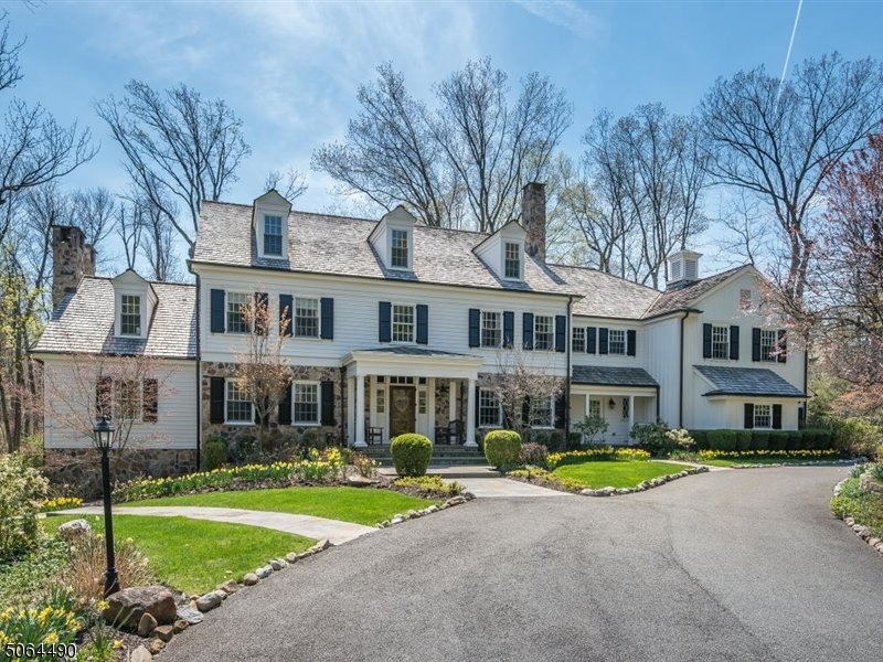 Spectacular custom home in a private location set back on over two acres of lushly landscaped property. Built in 2006, this incomparable residence has no shortage of space and style. Grand two-story Foyer, mahogany paneled Study, formal Living and Dining Rooms blend effortlessly with oversized eat-in Kitchen and Family Room. Primary Suite with sumptuous Bath, Dressing Rooms and Sitting Room that opens to sun deck overlooking resplendent grounds. Four additional en-suite Bedrooms on second level. Third floor Studio, Office/Bedroom and Bath. Lower level Gym, Poker Room, Music Studio and Rec Room. Bluestone patios take full advantage of the gorgeous property that features a koi pond with waterfalls, paths, footbridge, hot tub and whimsical playhouse. Essex Fells is an idyllic hamlet with easy commute to NYC.