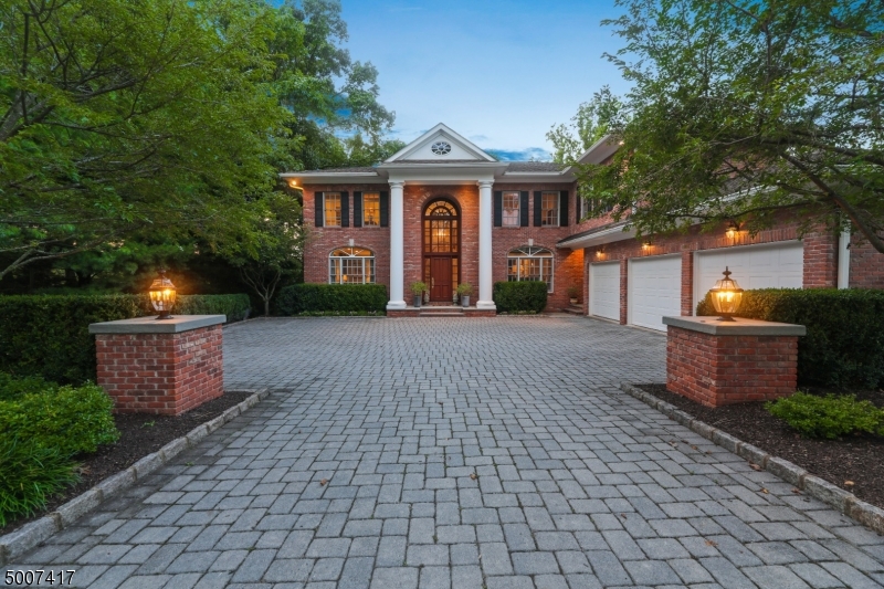 This stunning brick Center Hall Colonial features incredible natural light, a great floor plan w/ 5 bedrooms & 3 full baths on 2nd level, & terrific amenities such as a Commercial 25 Kw Generator, 3 zones HVAC & attached 3-car garage. Stunning living room leads to office overlooking backyard. Family room features wood-burning FP & pair of French doors that open to eat-in kitchen w/ custom cabinetry. Dining Room, mudroom & laundry room complete the 1st level. 2nd level features 5 bedrooms & 3 full baths, including a luxurious master suite w/ 10  tray ceiling, gas FP w/ elegant mantle, oak floors, 2 custom WICs & spa-like master bath. Walkout lower level features 9' ceilings, rec room w/ FP & nanny/in-law suite. Backyard is inviting & private, w/ mature landscaping & room for a pool. Ideal Deerfield location!