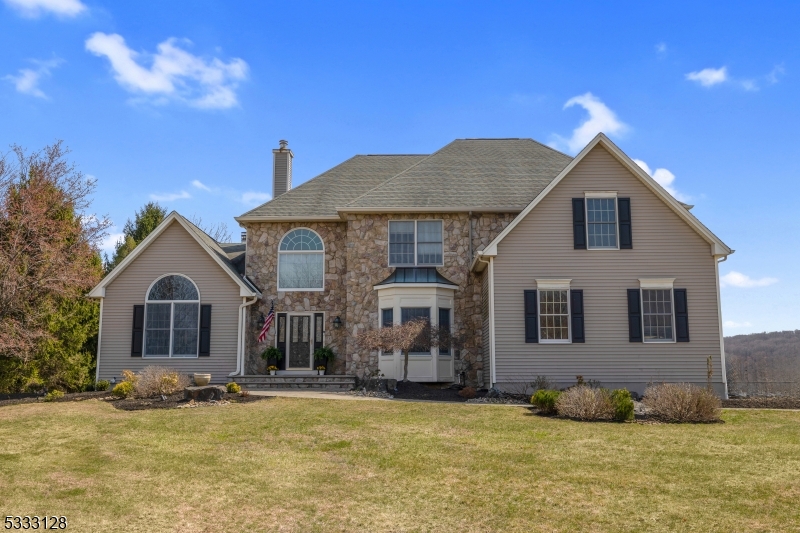Beautiful Valley Colonial home with two story entry foyer and 13' ceilings in formal living room and family room.  Formal dining room with hardwood flooring connects to a spacious kitchen through a butlers pantry that includes a granite countertop. White, modern kitchen with a large eating area, center island, built in wall and microwave oven, electric cook top. The kitchen opens up to the family room and outdoor deck with expansive views of rolling hills. Family room features 13' ceilings, wood burning fireplace, recessed lighting and leads to a formal living room. First floor also offers a home office, full bath and laundry room with washer and dryer included. Second floor has hardwood throughout, 4 spacious bedrooms, two with J&J bath. Primary master bedroom with tray ceiling, recessed lighting, separate sitting room/office with french doors, two walk-in in closets, full bath with double vanity, shower and separate jetted tub. Finished walk out basement includes exercise room, rec room, storage and utility rooms and sliding glass door to patio. Fantastic valley location on beautiful open, usable lot with amazing views. Part of old farmers school district - a  2018 national blue ribbon school and West Morris Central which includes an IB Program. Generator hookup, fully fenced back yard, two zone heating and air conditioning with heating and A/C units for each zone, recessed led lighting, underground sprinkler system and more. Califon mailing address 07830