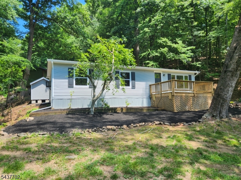 Renovated Ranch with Mountain Views in Solitude Village. Almost everything is new. This is the one you have been waiting for and it will not last. New roof, gutters, leaders, railings & decking on front porch, rear patio, ac & heat wall units, flooring, paint (inside), electric fireplace & tv already mounted, kitchen with SS appliances & granite counters, front & rear exterior doors, insulation & sheetrock ceiling inside, water heater replaced approximately 2022. Private location, 2 car wide driveway, easy in & out location. Community Inground pool, playground & basketball court. Train to NYC from High Bridge or Annadale, Bus to NYC from Clinton, Newark Airport (43 miles East) & Lehigh Valley International (40 miles West). Walk to downtown High Bridge, The Columbia Trail, Ken Lockwood Gorge & Lake Solitude/Waterfalls. Minutes to Historic Downtown Clinton for shopping & dining.