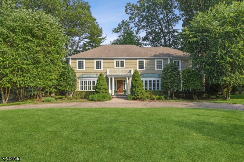 Sophisticated colonial residence with an expansive open floor plan was designed by the renowned architectural firm of David Rosen Architects. Located on sought after Dale Drive, which is a quiet cul de sac street, in the desirable Hartshorn Section of Short Hills. This sun-soaked gem, features a lovely living room, an elegant dining room and  a sophisticated gourmet kitchen to delight the most discerning chef! Oversized center island, stunning, custom wood cabinets and all high end stainless steel appliances: a 60" range, 2 dishwashers, 2 sinks, double door designer refrigerator and freezer. The front to back family room has a fabulous custom wet bar and is located conveniently off the kitchen. Gleaming hardwood floors, recessed lights, large windows through out. A very large breakfast room overlooking the park-like property, spacious office and powder room are on the first level. The breakfast room and family room, both open onto the wonderful large deck and picturesque garden.